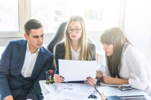 M&A advisory team analyzing business valuation documents