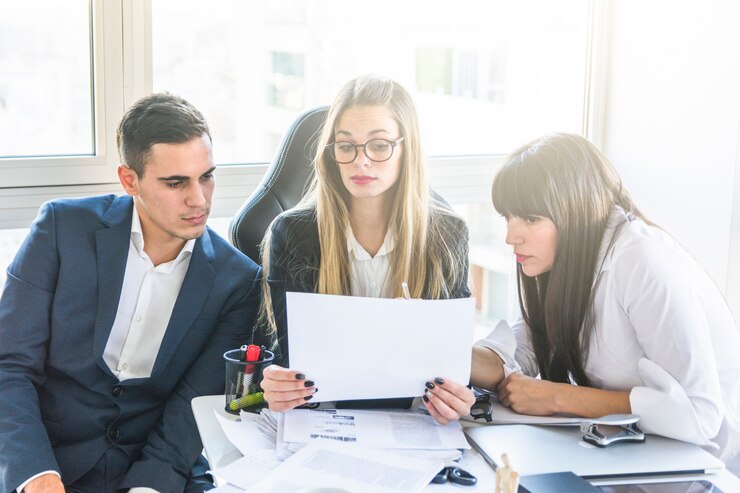 M&A advisory team analyzing business valuation documents