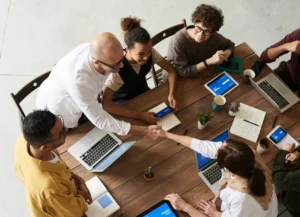 M&A consultants collaborating on client acquisition strategy