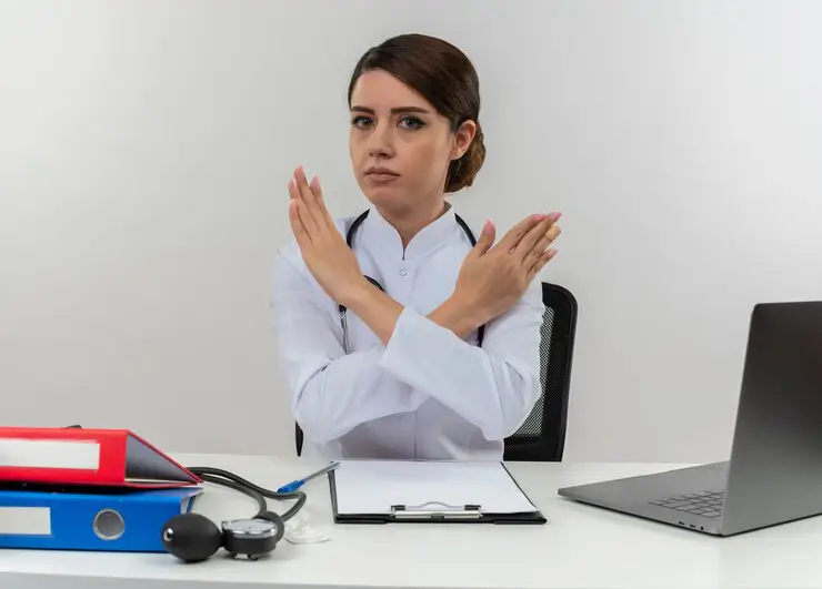 Healthcare professional refusing partnership offer – representing risks in M&A transactions