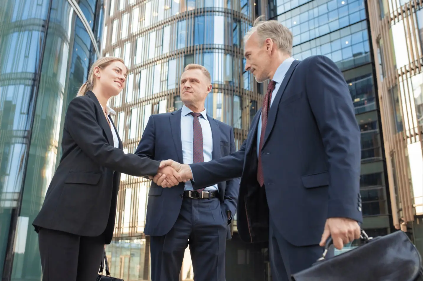 Successful business deal and partnership handshake after acquisition
