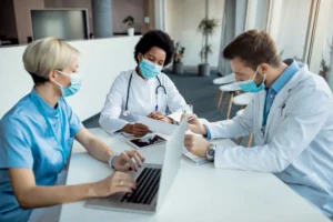 Healthcare M&A professionals analyzing clinical and financial data
